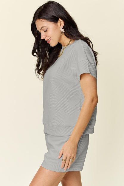 Textured short-sleeve t-shirt and drawstring shorts.