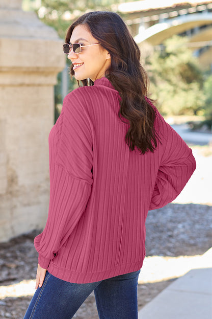 Ribbed knit top has a Mock Neck